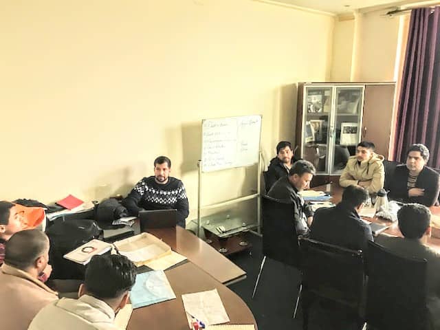 Meeting in room with two tables